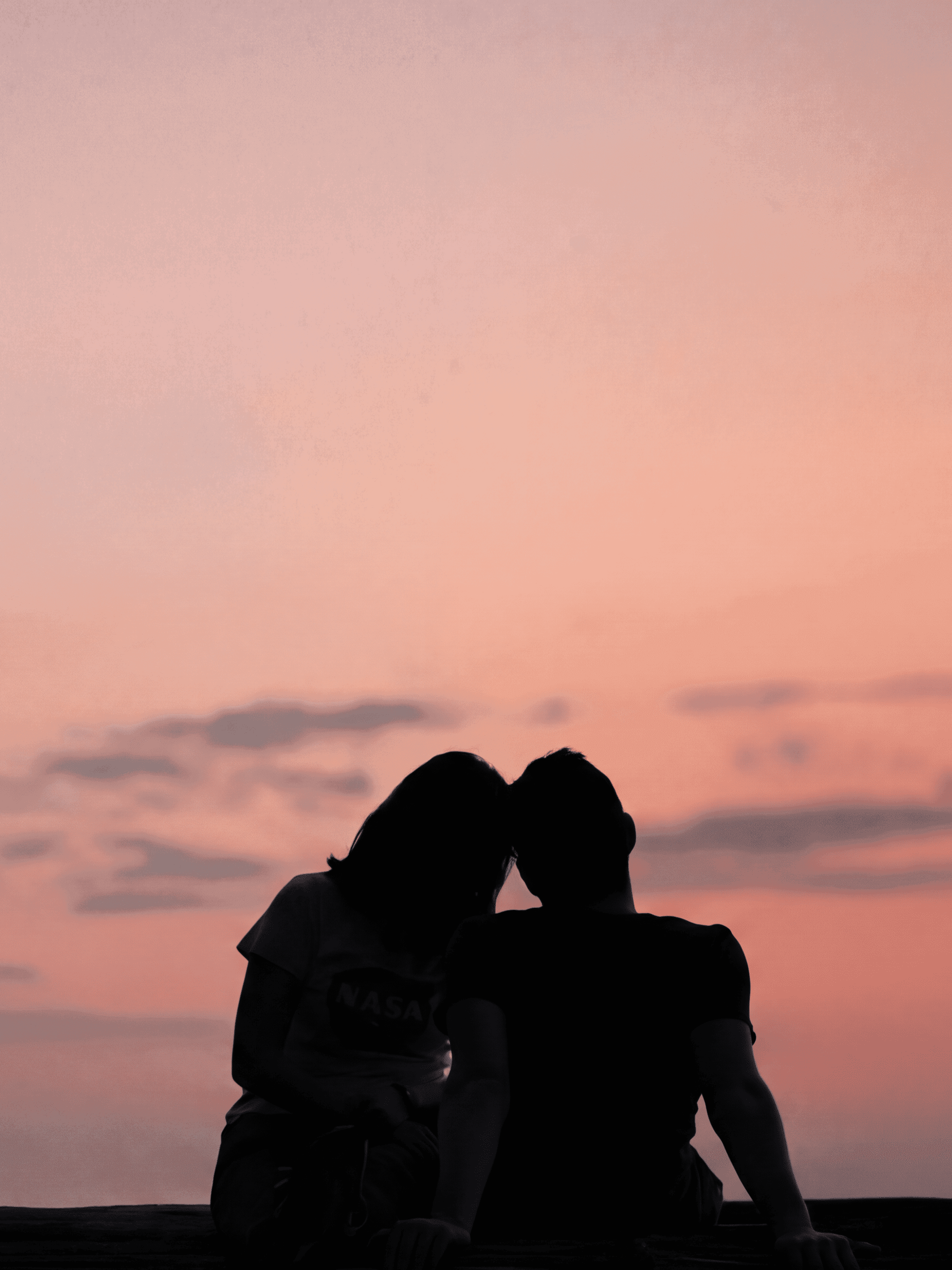 A couple enjoying a romantic sunset together